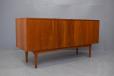 The sideboard can be used for room diving as its back panel is also teak