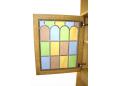 Coloured leaded glass cupboard doors on Danish oak wall units.