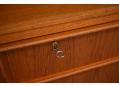 Solid teak lip handles on each drawer front with the top being lockable.
