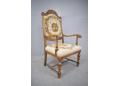 Decorative oak framed antique Danish throne chair in cross-stitch fabric.
