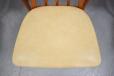Cream colour vinyl seat upholstery is in good condition on all chairs