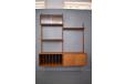 Midcentury wall mounted shelving system with record storage