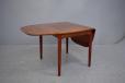 Vintage rosewood dining table with drop leaves produced 1970s
