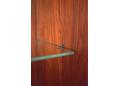 Wall mounted CADO cabinets & shelves by System CADO on wall panels.