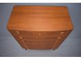 Teak chest of 6 drawers with inset carved square handles made in Denmark.
