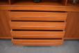 Each side contains a single adjustable shelf.