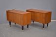 Matching pair of vintage teak bedside cabinets with tapering black legs