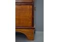 The chest stands firmly on a mahogany leg frame.