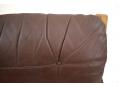 Brown leather upholstered cushion on Hunter chair.