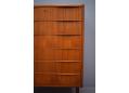 Teak chest of 6 drawers with wave handles made in Denmark.