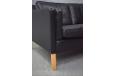 Black ox leather upholstered 2 seat sofa with space saving box design frame