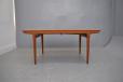 Johannes Andersen design teak dining table with 2 pull out leaves produced by Uldum Moblefabrik