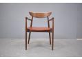 Minimalistic rosewood frame armchair by Harry Ostergaard