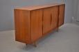 Zebra wood faced shallow drawers are lined with green felt