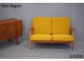 Vintage 2 seater oak cigar sofa with teak arms by Hans Wegner