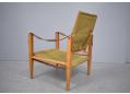 Model 'Safari' easy chair in green fabric upholstery.