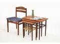Danish design nest of 3 tables in teak with woven cane shelf. SOLD