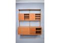 The shallow sliding door cabinets contain 2 shelves and the deeper cabinet has a single shelf.