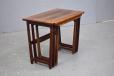 Rosewood nest of 3 tables which slide into each other making them easy to handle