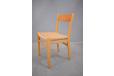 Beech and teak dining chairs with woven cord seat produced by 1956