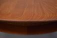 Solid teak table top is evident from the wood grain which is continuous through the thickenss