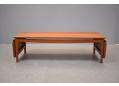 Minimalistic lounge table in solid teak with drop leaves by France & Son.