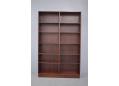 Shallow bookcase with double bank and adjustable shelves. Gunni Omann design