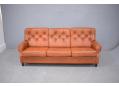 Stylish and comfortable 1970s 3 seater in original soft orange / tan colour leather