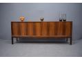 Scandinavian low sideboard with sliding doors. Made of brazilian rosewood.