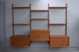 ROYAL system in vintage teak featuring 3 drop front locking cabinets and 6 adjustable shelves