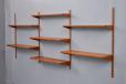 Wall mounted bookcase with modulkar shelves designed in 1952 by Kai Kristiansen
