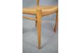 Set of light oak dining chairs with woven papercord seats by Niels Moller