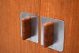 Solid teak grip handles with polished steel back plate.