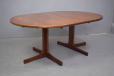 Rosewood round dining table with pedestal legs for sale