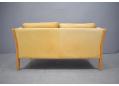 Tan colour ox leather upholstered 2 seat sofa made by Stouby in Denmark.