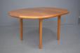 Vintage round teak dining table extending with centrally stored fold out leaf