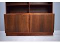 Cupboard door base cabinet with bookcase top. Made by Hundevad & Co.