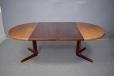 Round rosewood dining table with 2 extra leaves