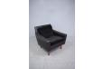 Vintage 1950s black leather armchair with velvet cushions