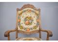 Floral pattern cross-stitch fabric upholstery on throne chair.