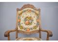 Floral pattern cross-stitch fabric upholstery on throne chair.