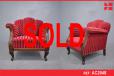 Large antique armchair with dark wood carved detail and red velour upholstery - view 1