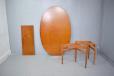 oval top dining table in teak extending with one extra leaf by Arne Vodder
