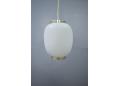 China pendant with brass fittings and frosted diffuser in glass.