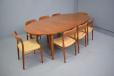 Teak model 212 dining table with tripod legs produced by Sibast furniture