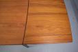 Compact extending teak dining table produced by Danish Mobelfabrik