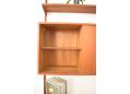 The cabinets contain an assortment of drawers, shelves & a record holder.