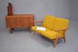 1955 design Cigar sofa in oak with contrasting teak arm rests, 2 available.