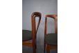 Fabric upholstered JOHANNES ANDERSEN dining chairs.