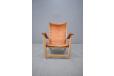 Oak frame lounge chair with tan saddle leather seat and arms. Mogens Voltelen design
